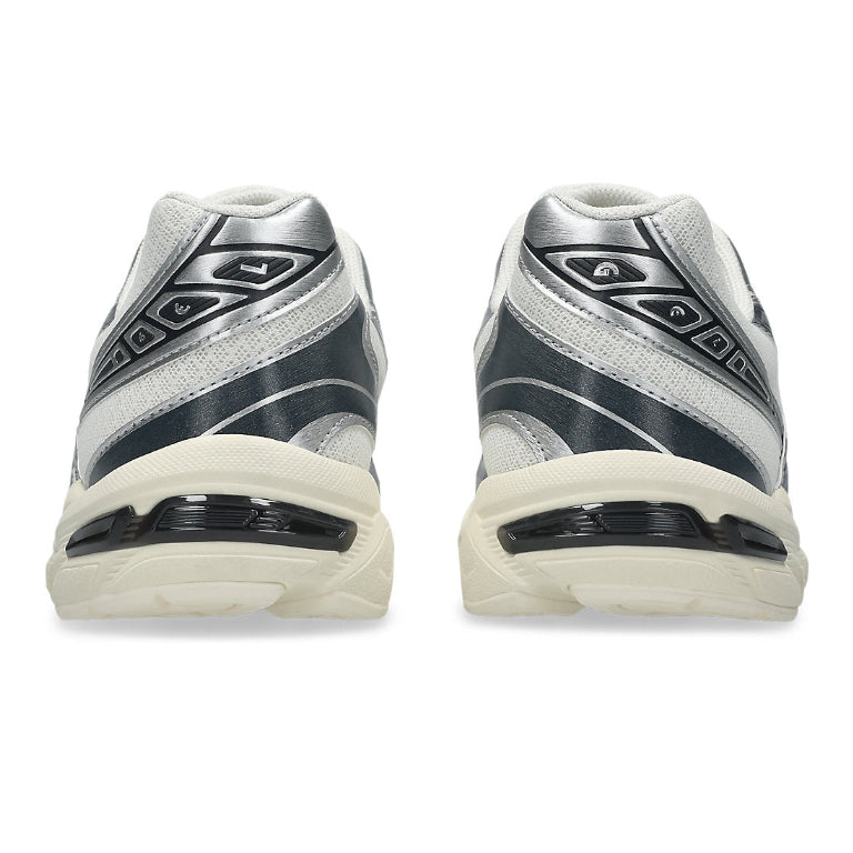 A rear view of the ASICS GEL-1130 Cream Carrier Grey trainers, showing the structured heel, neutral cream and grey detailing and sculpted sole on a clean white background.