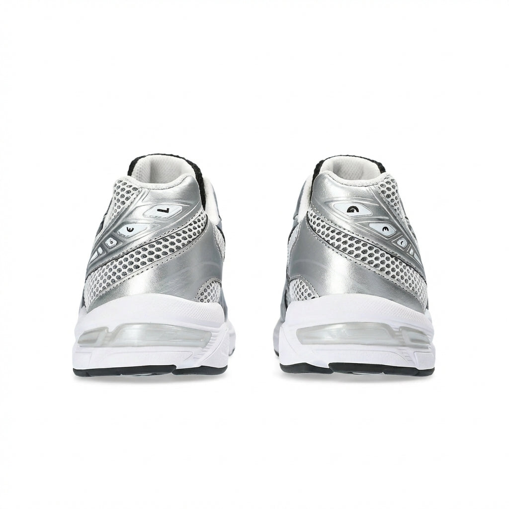ASICS GEL-1130 White Black Silver rear heel view of both shoes showing the prominent metallic silver overlays wrapping the heel, white mesh upper, black inner collar lining, white midsole with translucent GEL window, and black rubber outsole