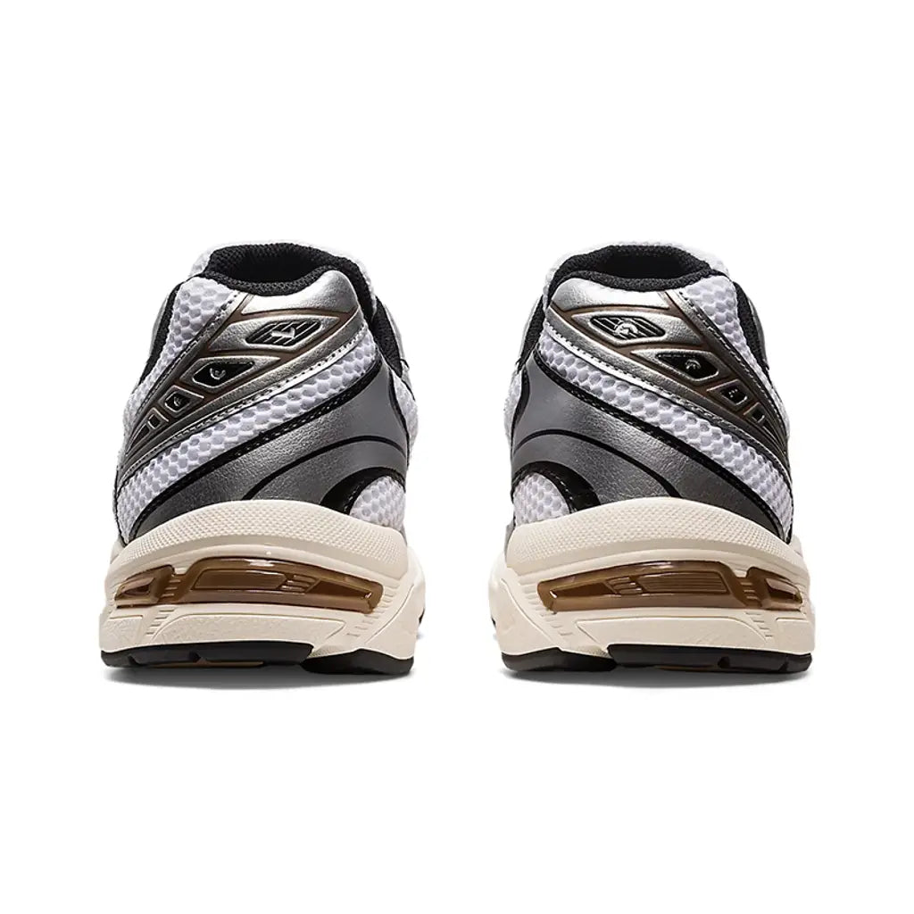 ASICS GEL-1130 White Clay Canyon straight rear view of both shoes showing the black and silver heel counter construction, brown Clay Canyon accent stripes, white mesh upper, and bronze GEL windows in the pre-aged sail midsole