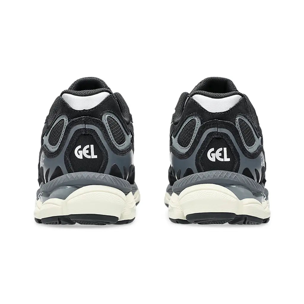ASICS GEL-NYC Black Grey rear heel view of both shoes showing white GEL branding on the black mesh heel, grey synthetic overlays wrapping the heel counter, translucent grey GEL windows, white inner collar lining, and cream foam midsole
