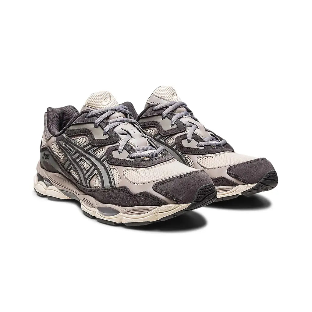 ASICS GEL-NYC Oatmeal Obsidian Grey 1201A789-250 front three-quarter pair view showing the oatmeal mesh toe box, dark obsidian suede toe cap overlays, grey tiger stripes, grey laces, oatmeal tongue, and cream midsole with GEL windows on both shoes