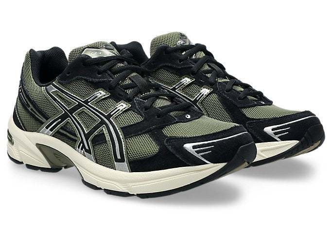 ASICS Gel-1130 Irvine Black pair front three-quarter view on white background showing olive and black colourway with silver detailing and cream midsole