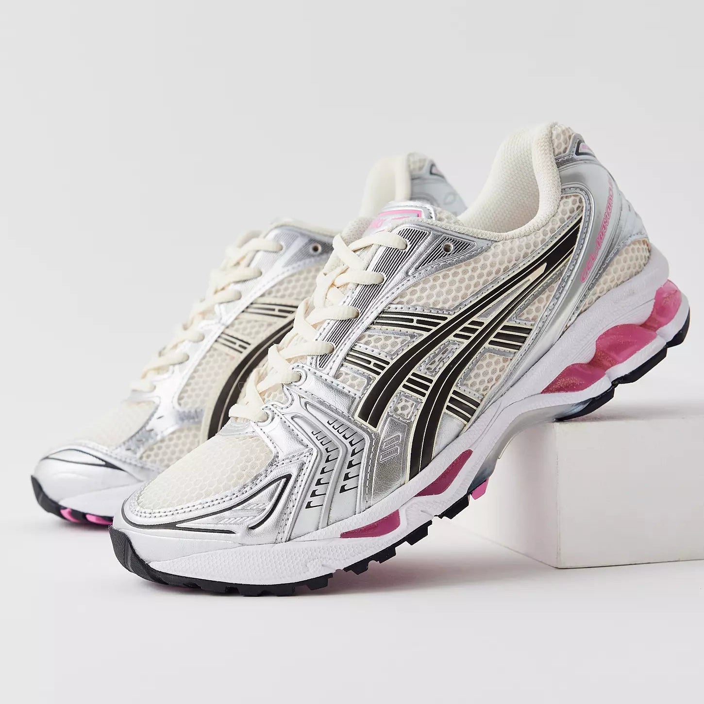 ASICS Gel-Kayano 14 Cream Sweet Pink pair front angled view showing silver overlays and pink GEL midsole