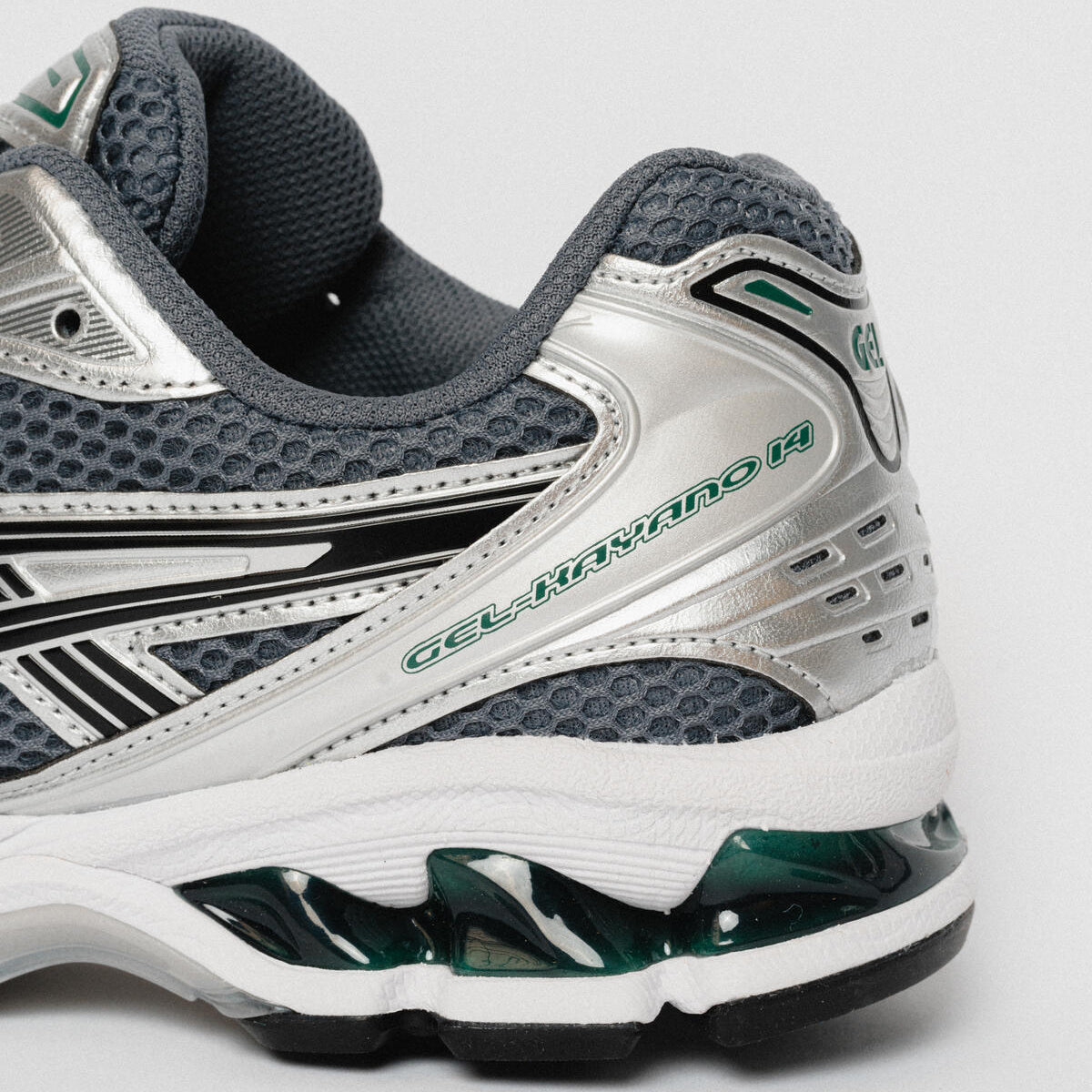 ASICS Gel-Kayano 14 Metropolis Jasper Green heel close-up showing silver heel counter, Gel-Kayano 14 branding, and translucent jasper green GEL cushioning unit