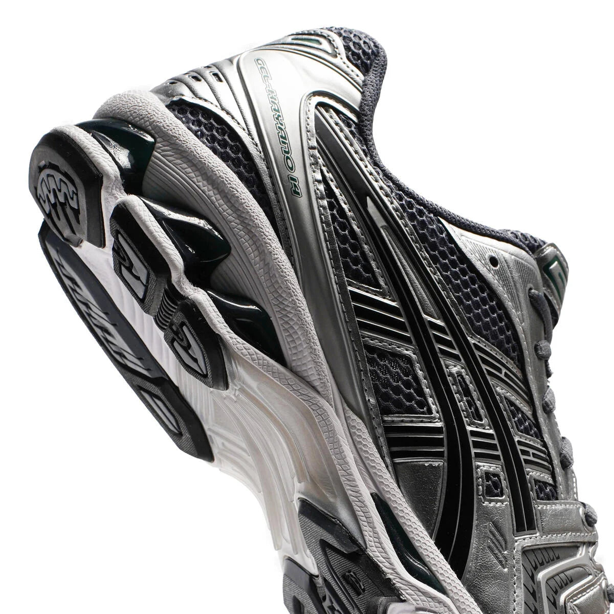 ASICS Gel-Kayano 14 Metropolis Jasper Green angled view showing outsole tread pattern, white midsole, and jasper green GEL technology visible through sole