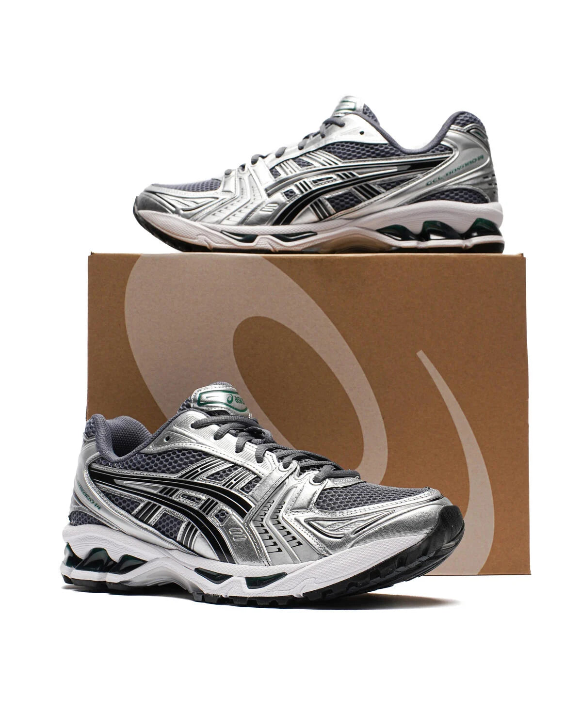 ASICS Gel-Kayano 14 Metropolis Jasper Green pair displayed with ASICS shoe box showing lateral and medial views with silver and grey detailing