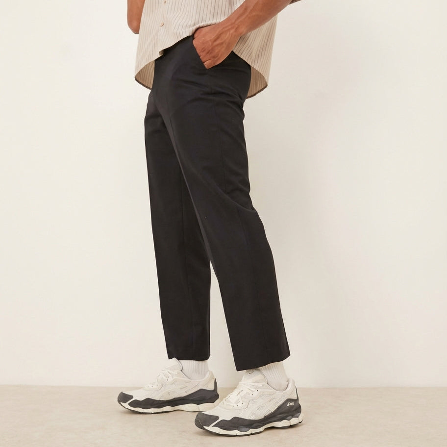 ASICS Gel-NYC Smoke Grey on feet full body styled with black trousers and striped shirt