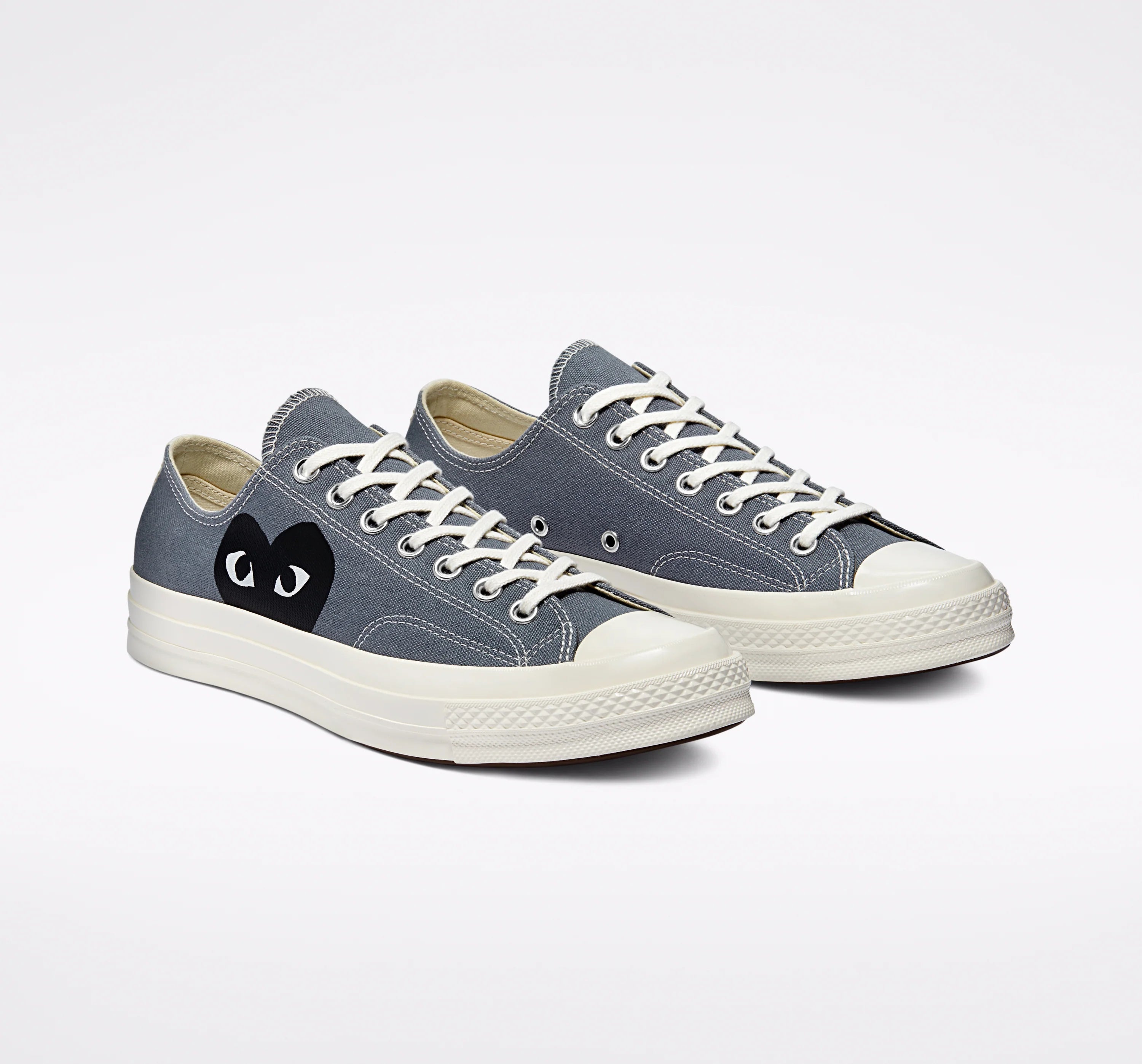 Comme des Garcons Play x Converse Chuck Taylor 70 Low Grey - front pair view showing both shoes with black heart eyes logo on grey canvas