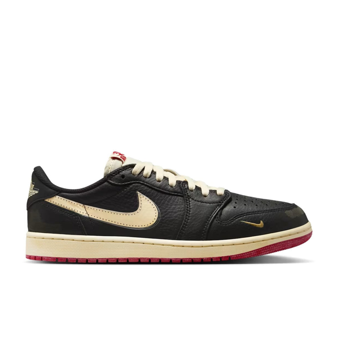 Nigel Sylvester x Jordan 1 Low OG Better With Time lateral side view showing pre-distressed black tumbled leather, muslin Swoosh, gold mini Swoosh, aged midsole, and varsity red outsole