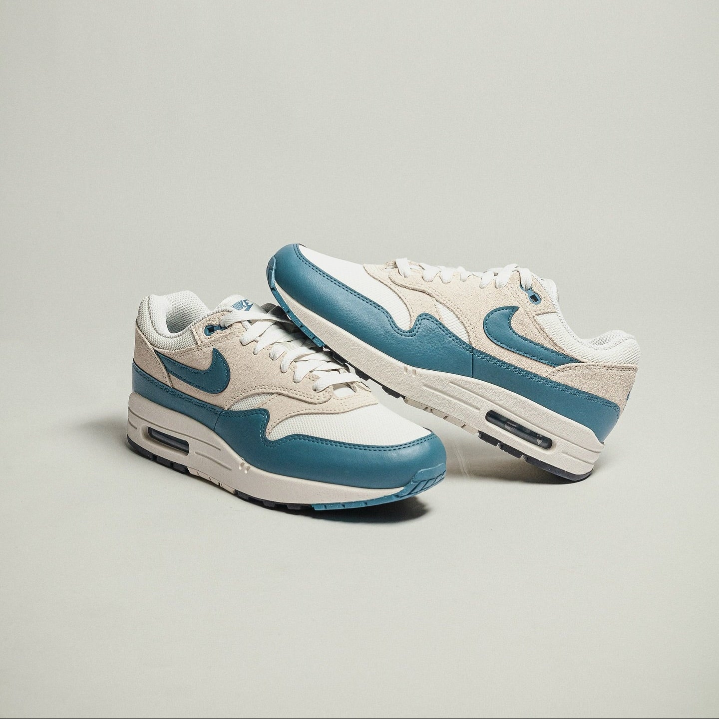 Nike Air Max 1 Soft Pearl Smokey Blue pair stacked studio shot showing lateral and medial sides with Air unit