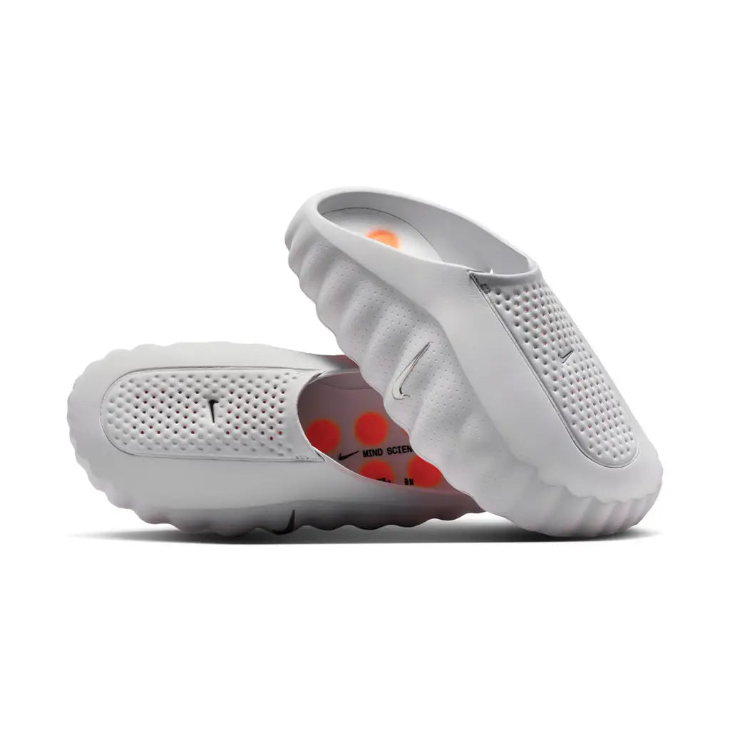 Nike Mind 001 Light Smoke Grey pair stacked showing perforated upper and Mind Science Department insole with orange dots