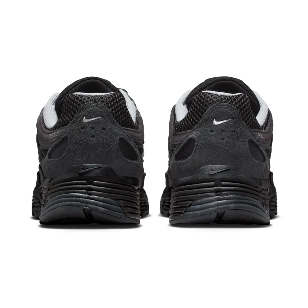 Nike P-6000 Suede Anthracite Metallic Silver rear view of pair on white background showing anthracite suede heel counter, small Nike Swoosh, and white inner collar