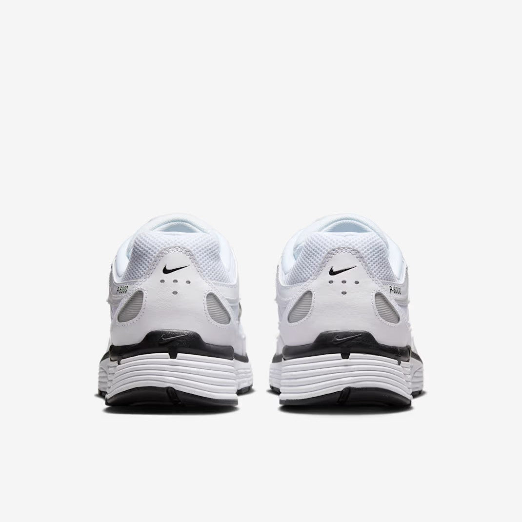 Nike P-6000 White Metallic Silver Black heel view showing black Swoosh P-6000 branding and white ribbed midsole