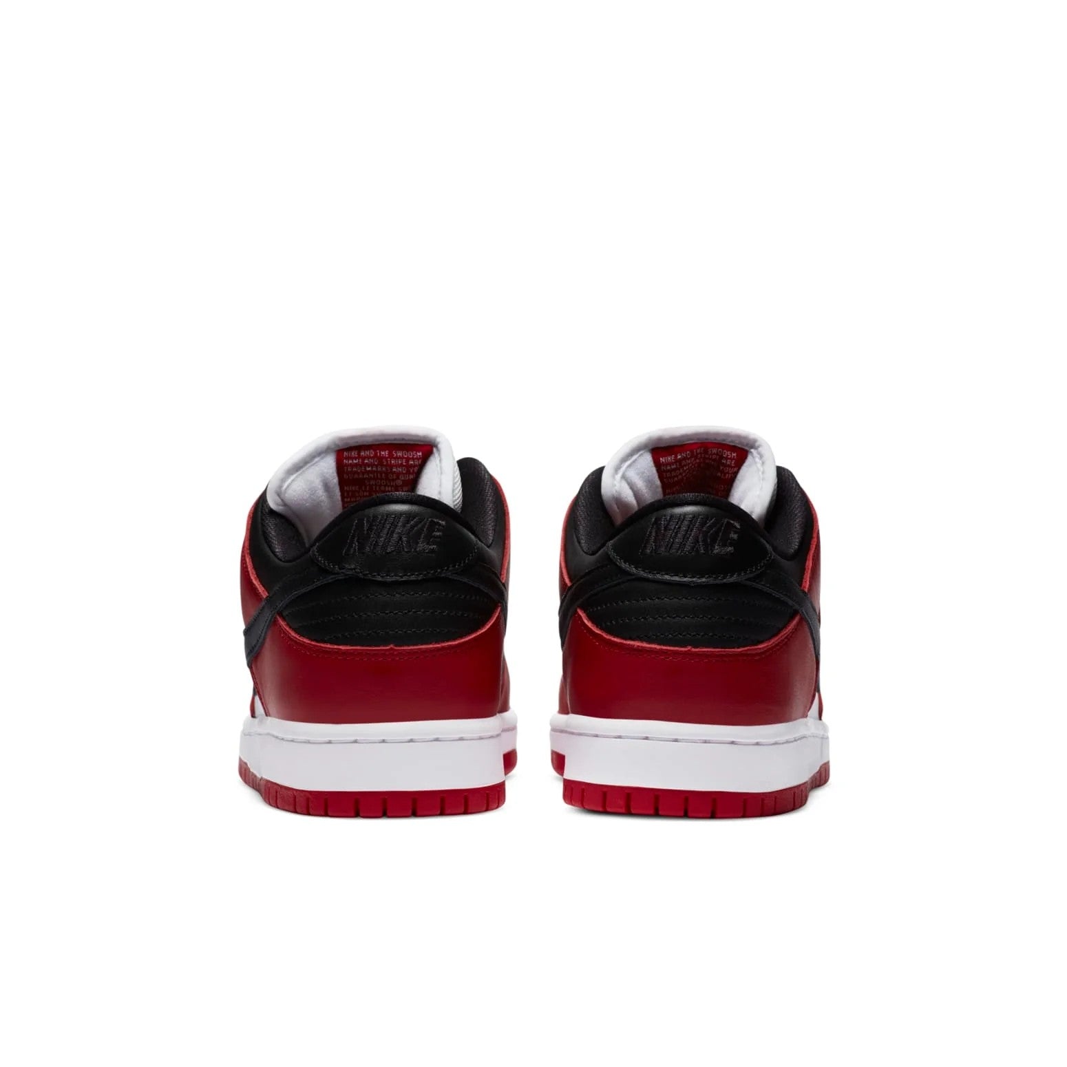 Nike SB Dunk Low J-Pack Chicago pair rear view showing black heel panel with embossed Nike branding and red outsole