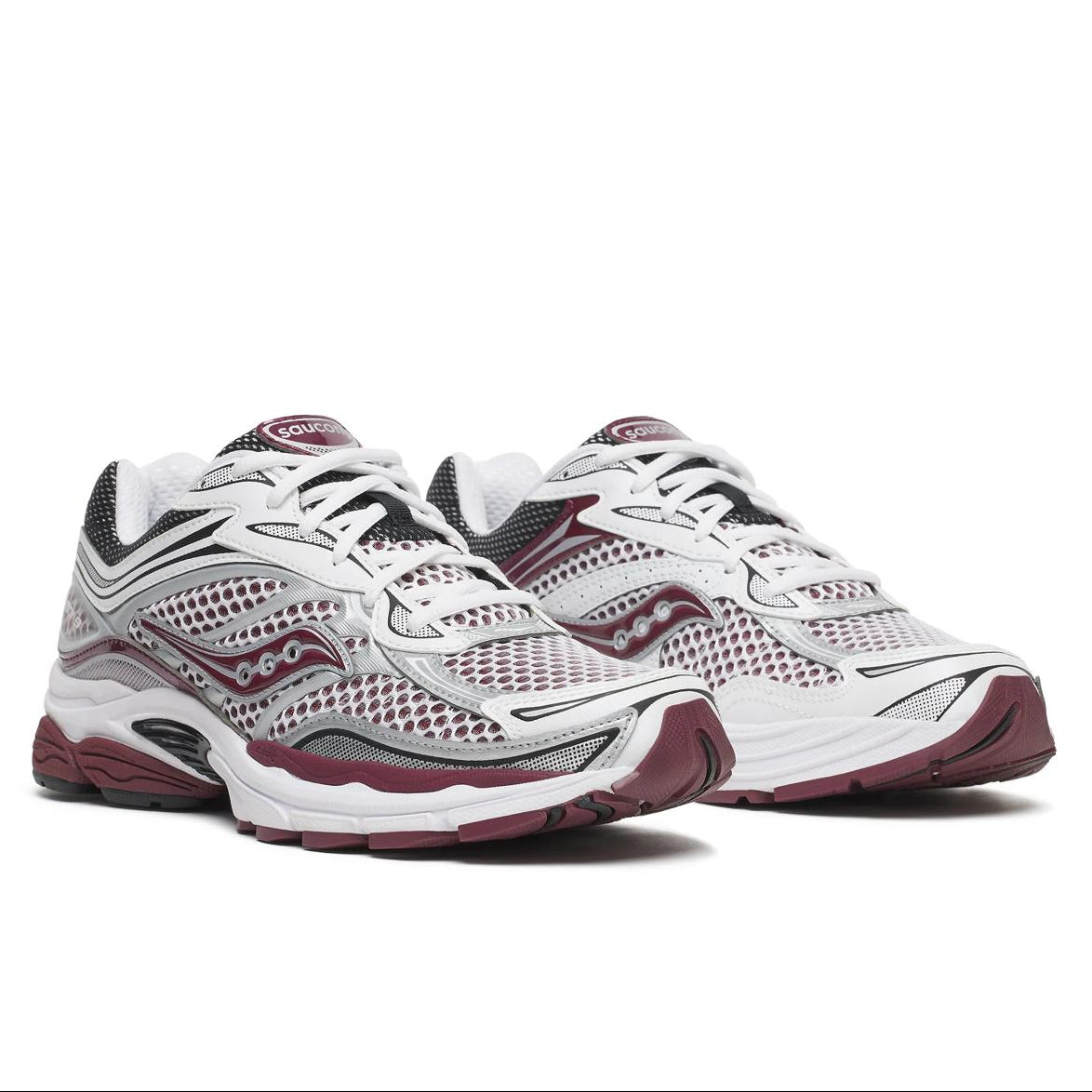 A pair of Saucony ProGrid Omni 9 White Maroon trainers featuring white mesh, deep maroon accents, layered technical overlays and a chunky sculpted sole on a clean white background.