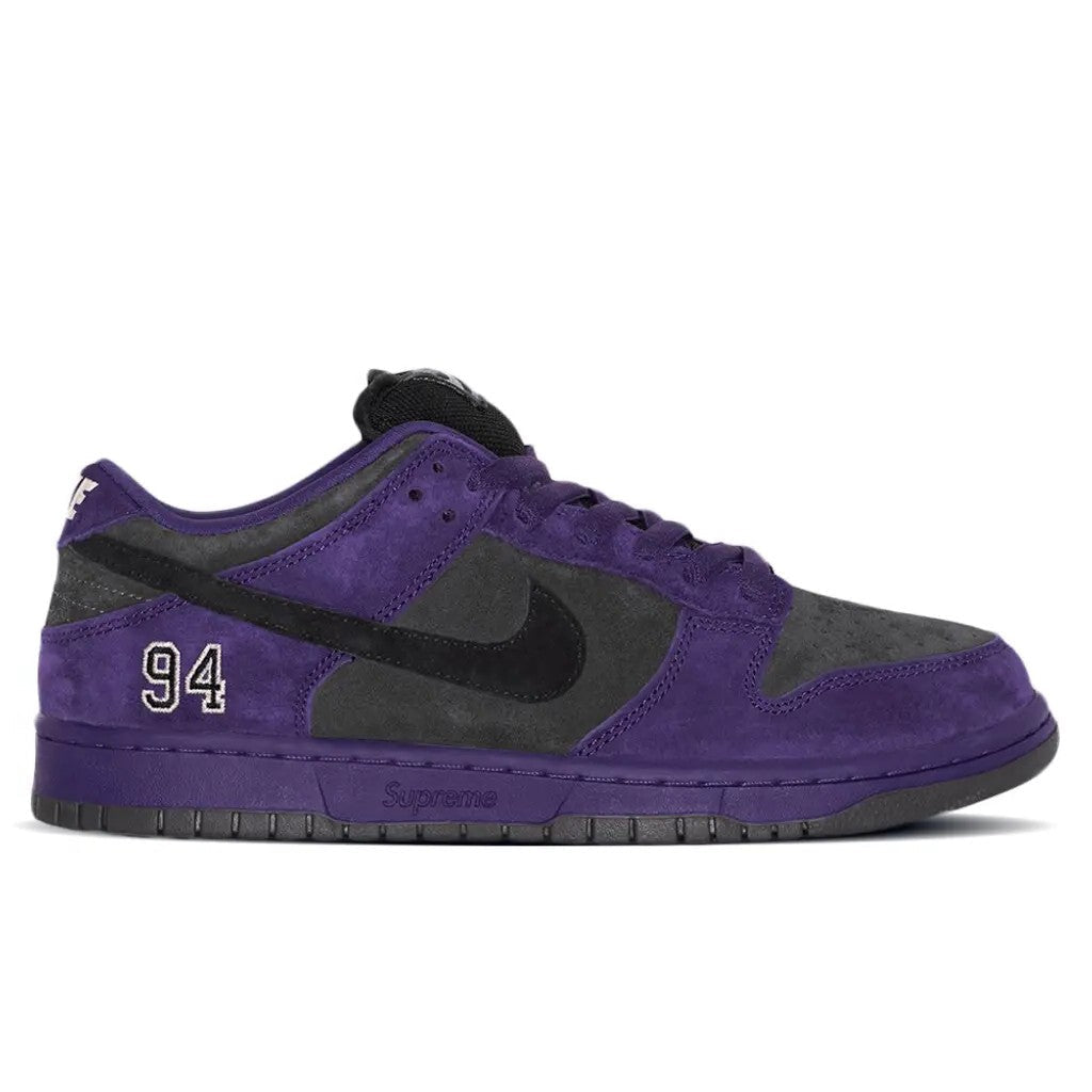 Supreme x Nike SB Dunk Low Ink Black lateral side profile showing full ink purple suede upper and Supreme branding