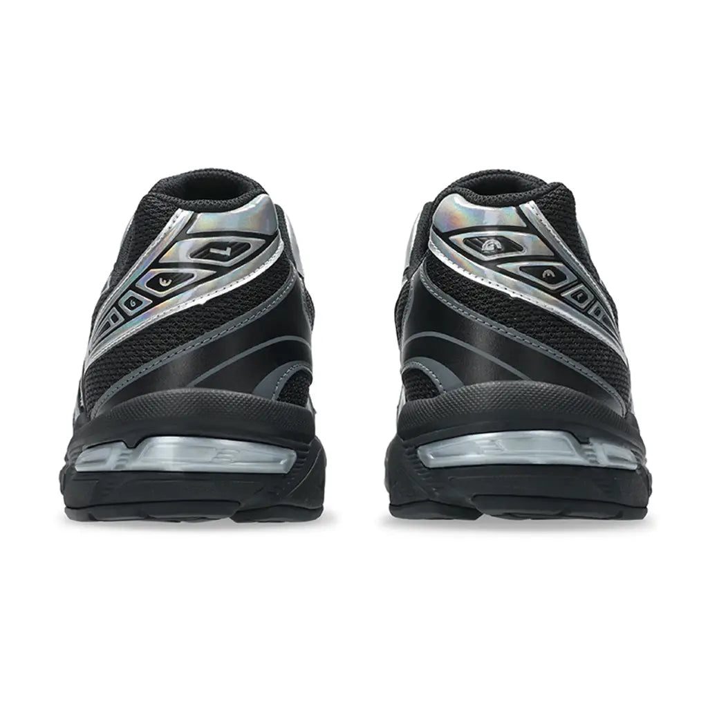 A rear view of the ASICS GEL-1130 Holiday Pack Black trainers, showing the structured black heel, iridescent silver accents and visible GEL cushioning on a clean white background.