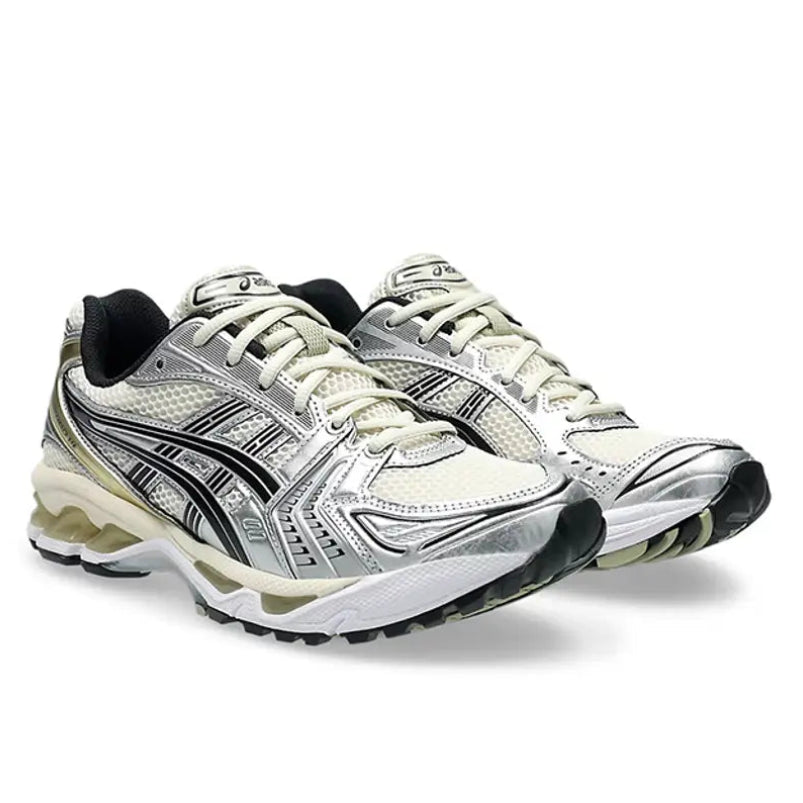A pair of ASICS GEL-KAYANO 14 Birch Silver trainers featuring off-white Birch mesh, metallic silver overlays, black ASICS stripes and a sculpted GEL-cushioned sole on a clean white background.