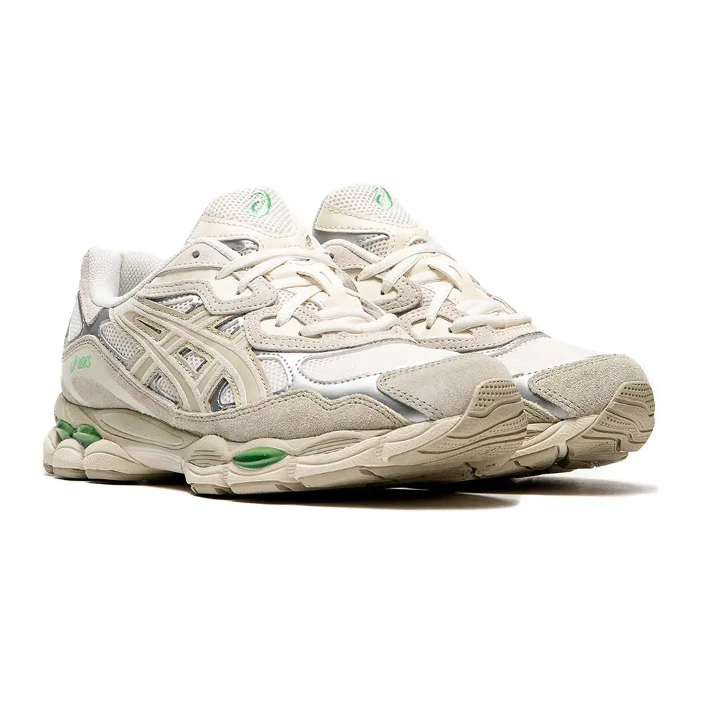 Front view of the unisex ASICS GEL-NYC Cream Fossil 1203A383-112 sneaker, showing the breathable large mesh toe box and soft earthy-toned retro overlays.