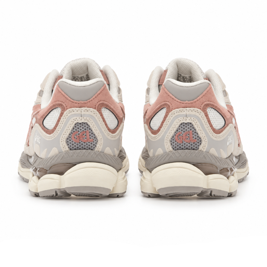 A rear view of the ASICS GEL-NYC Cream Umeboshi trainers, showing the structured heel, muted pink overlays, cream detailing and sculpted sole on a clean white background.