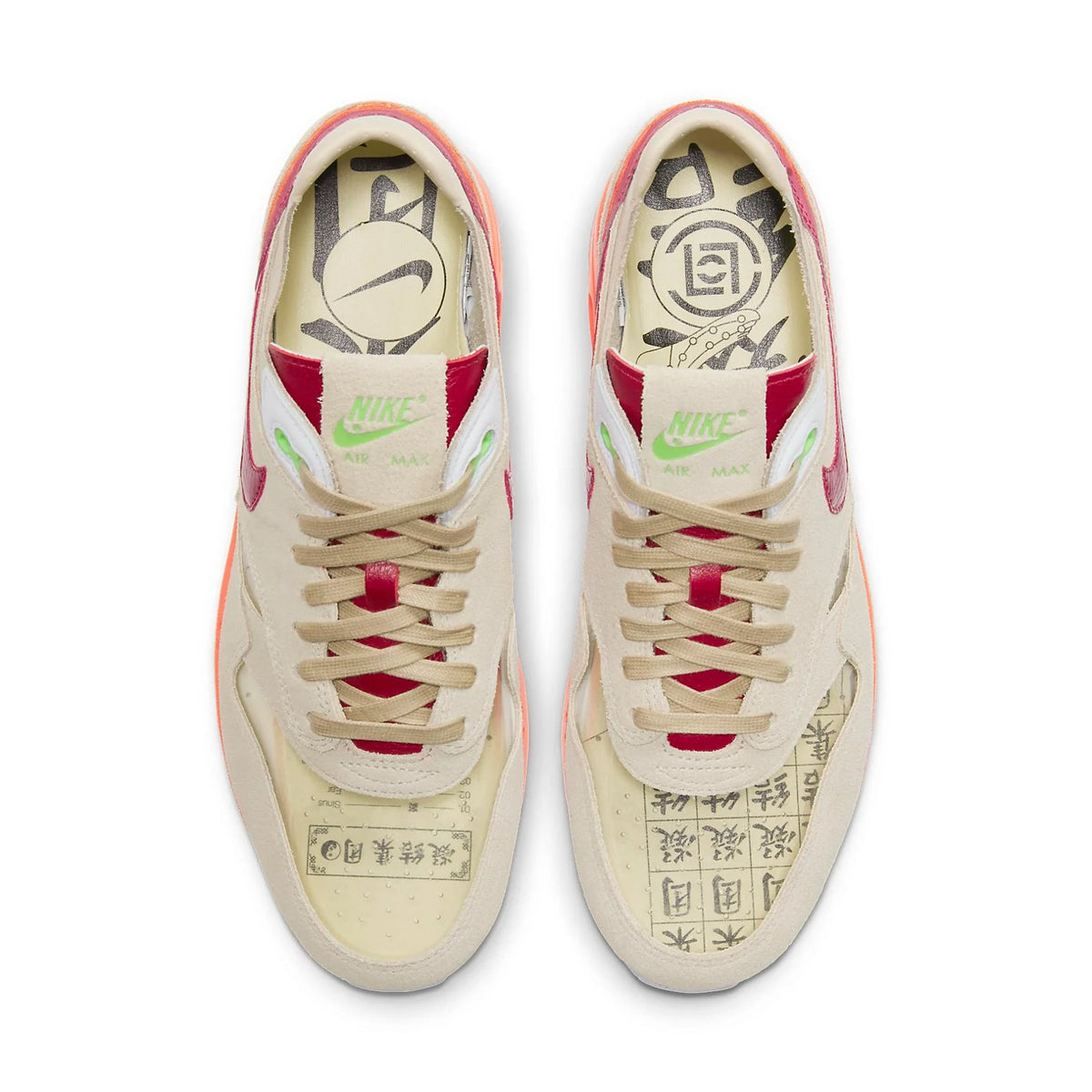 An angled view of the CLOT x Nike Air Max 1 Kiss of Death 2021 highlighting the transparent toe box, beige upper and contrasting red and orange accents.