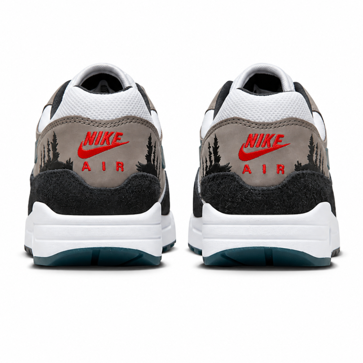 A rear view of the Nike Air Max 1 PRM QS Escape trainers, showing the red Nike Air branding, premium suede construction and embroidered treeline detail.