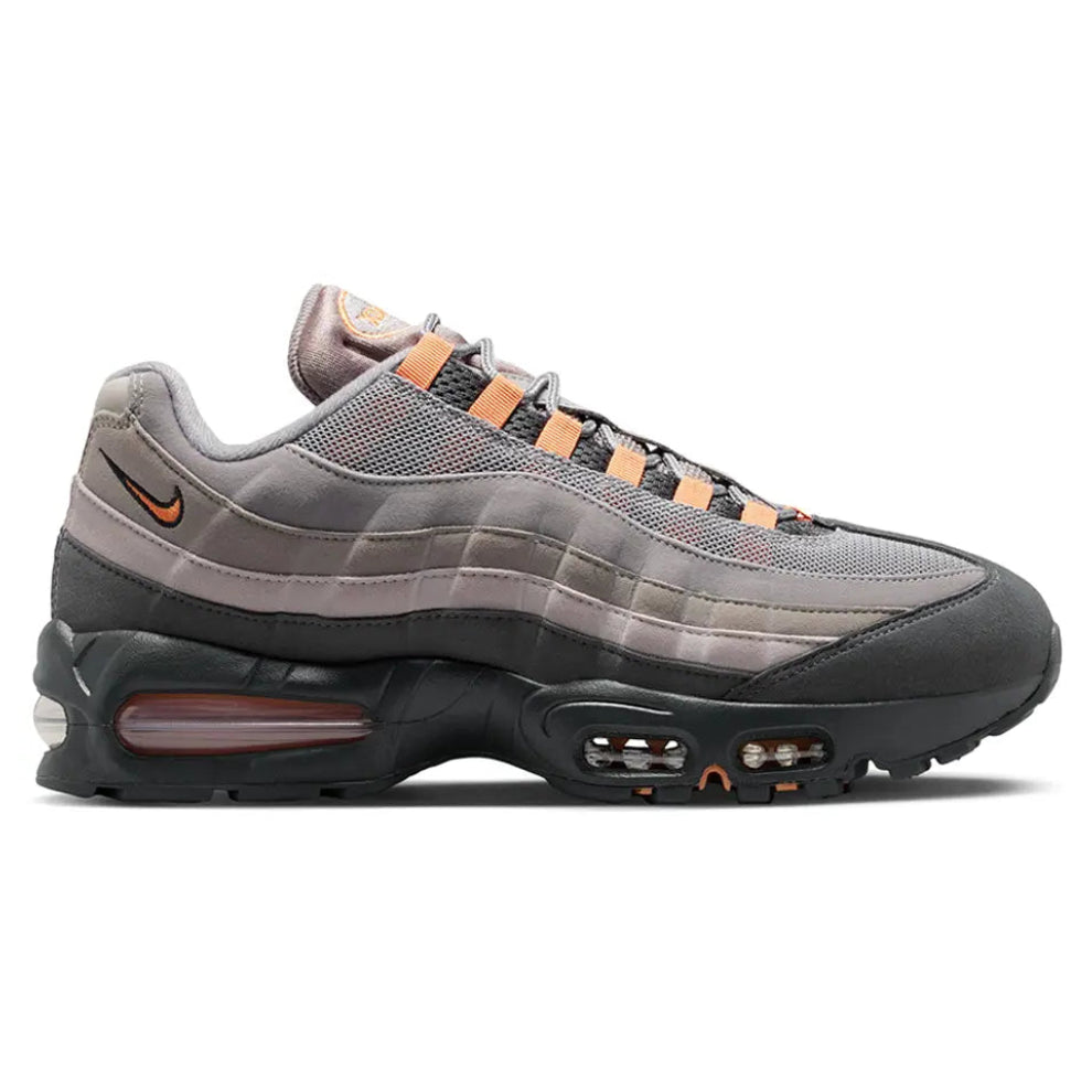 A side view of the Nike Air Max 95 OG Big Bubble Bright Mandarin trainer, showing the signature dark gradient panels, Bright Mandarin detailing, small Nike Swoosh and visible Air cushioning.
