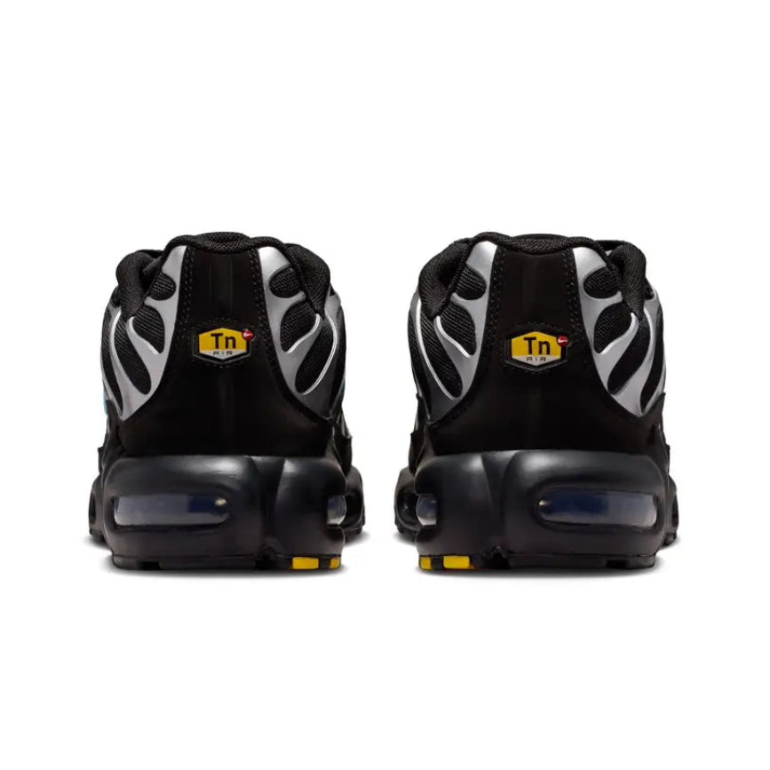 A rear view of the Nike Air Max Plus VII Scorpion Black trainers, showing the structured black heel, tonal detailing and visible Air cushioning.