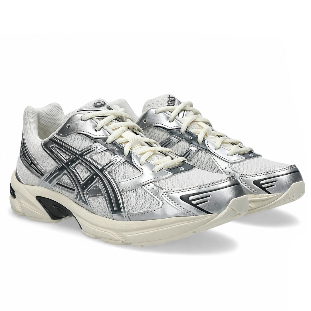 An angled view of the ASICS GEL-1130 Cream Carrier Grey trainers, showing the cream and grey layered upper, signature ASICS stripes, laces, and retro running silhouette on a clean white background.