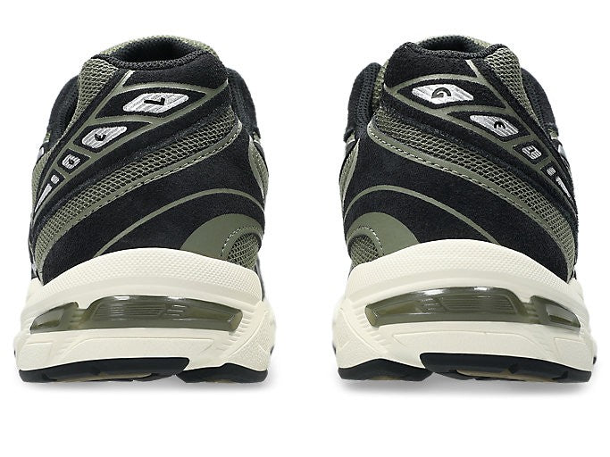 ASICS Gel-1130 Irvine Black rear view of pair on white background showing black suede heel, olive mesh panels, silver accents, and translucent olive GEL heel unit