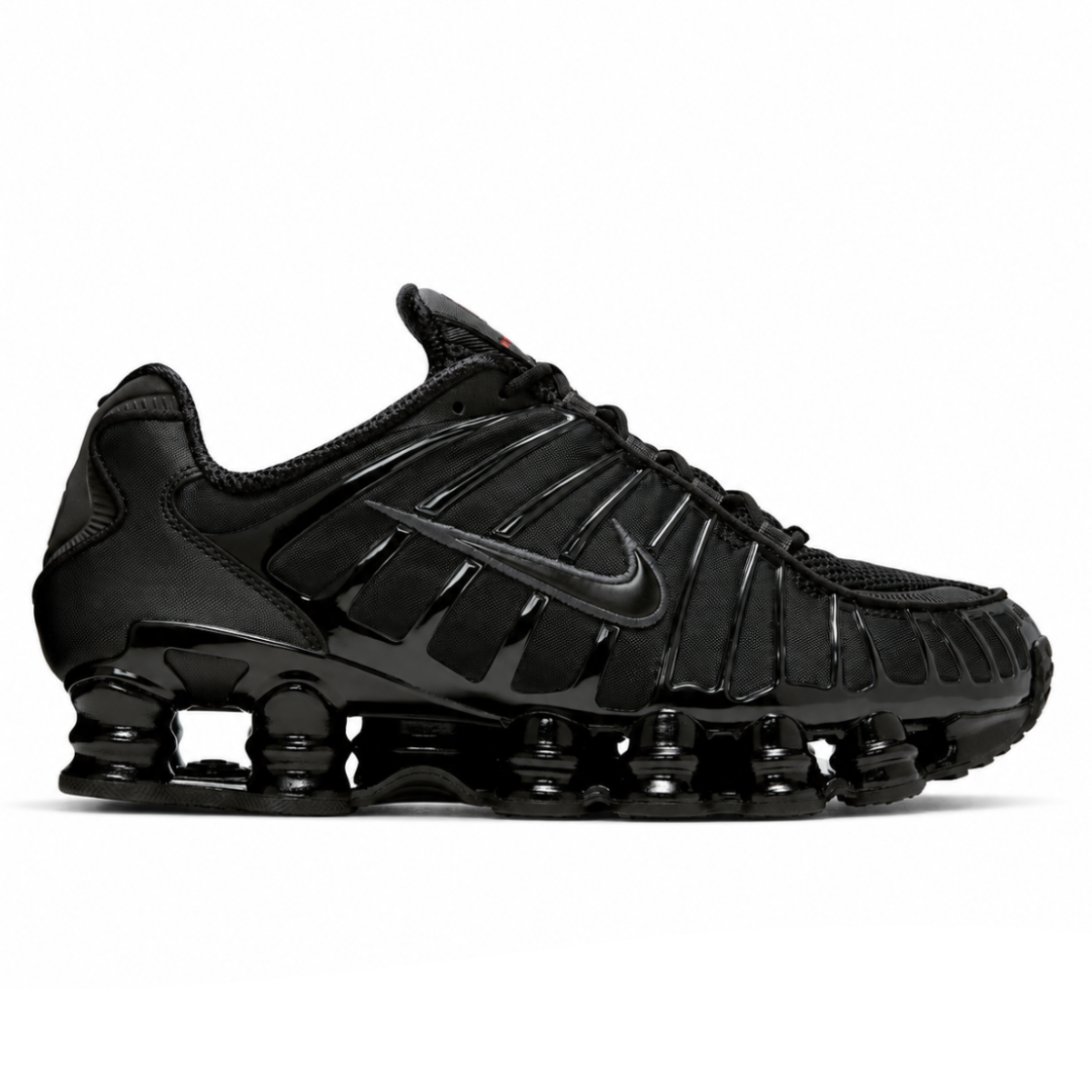 A side view of the Nike Shox TL Black showing the black mesh upper, synthetic overlays, tonal Nike Swoosh and full-length Shox cushioning system.