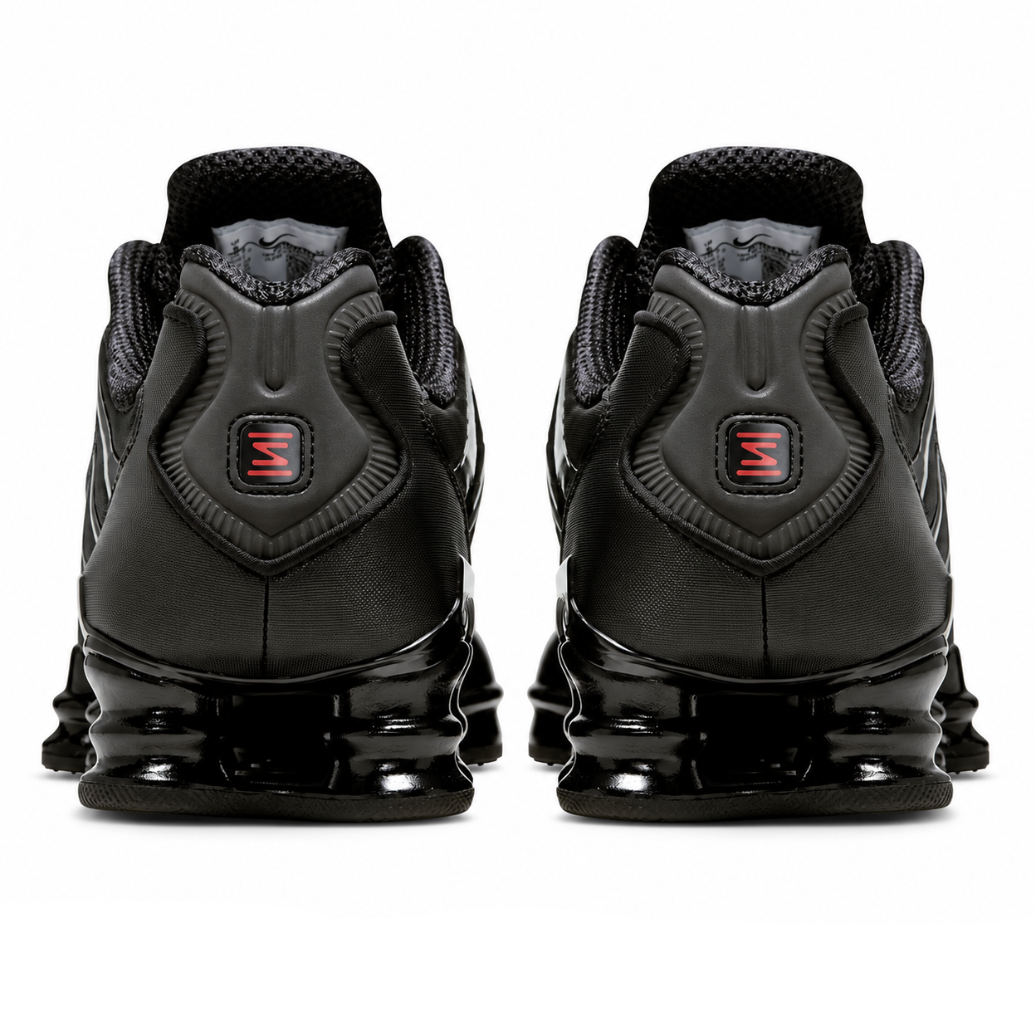 A rear view of the Nike Shox TL Black showing the stacked Shox columns, black heel structure and dark monochrome finish.