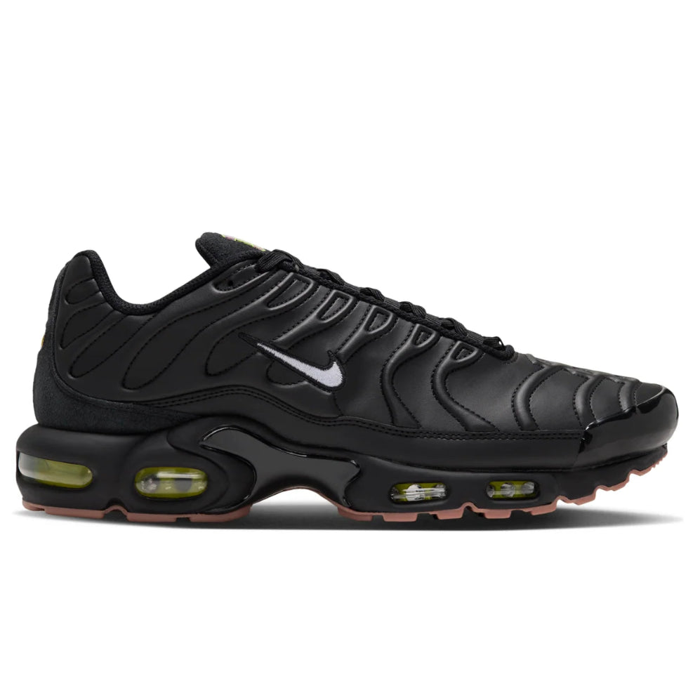 A side view of the Nike Air Max Plus Premier Black Volt showing the black stitched leather upper, white Nike Swoosh and sculpted Tuned Air sole.