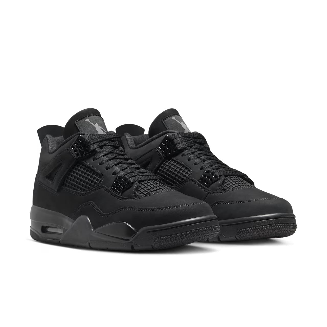 Jordan 4 Retro Black Cat 2025 GS pair front three-quarter view on white background showing grey Jumpman tongue logos, black nubuck upper, and tonal mesh netting