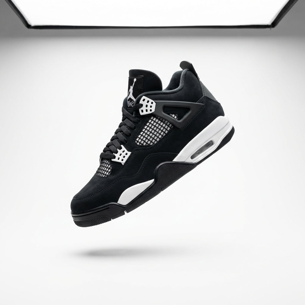 Jordan 4 Retro White Thunder GS - floating studio shot showing medial side with Jumpman logo on tongue, mesh netting, grey wing eyelets and white midsole