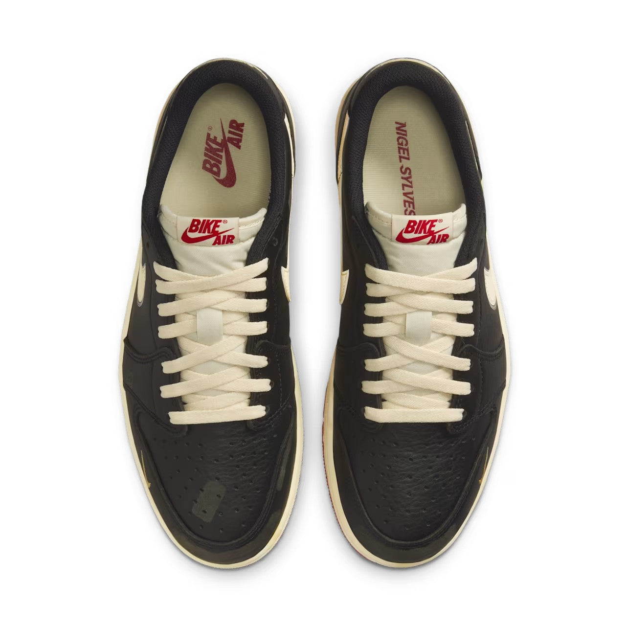 Nigel Sylvester x Jordan 1 Low OG Better With Time heel pair view showing gold Air Jordan Wings logo on black heel, aged cream midsole, and varsity red rubber outsole