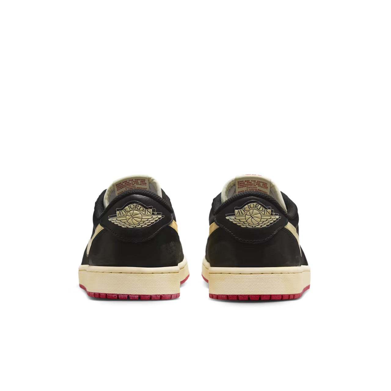 Nigel Sylvester x Jordan 1 Low OG Better With Time top down view showing Bike Air tongue branding in red, cream suede lace panel, black perforated leather toe box, and cream laces