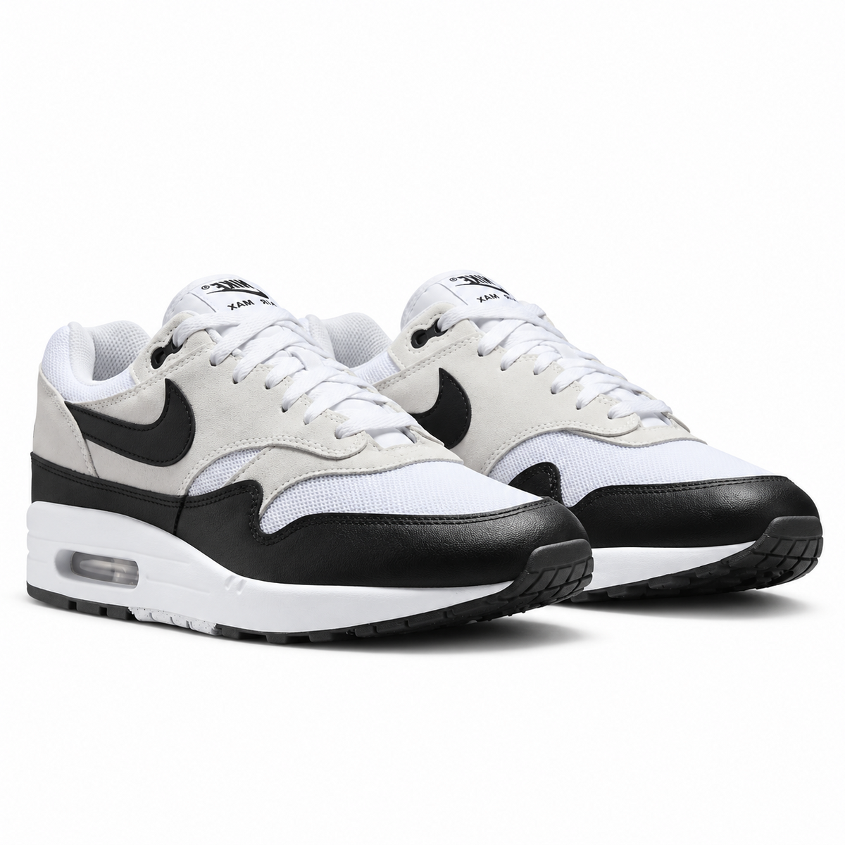 A pair of Nike Air Max 1 Essential Summit White Black trainers featuring Summit White mesh, tan suede overlays, black mudguards and visible Air cushioning on a clean white background.