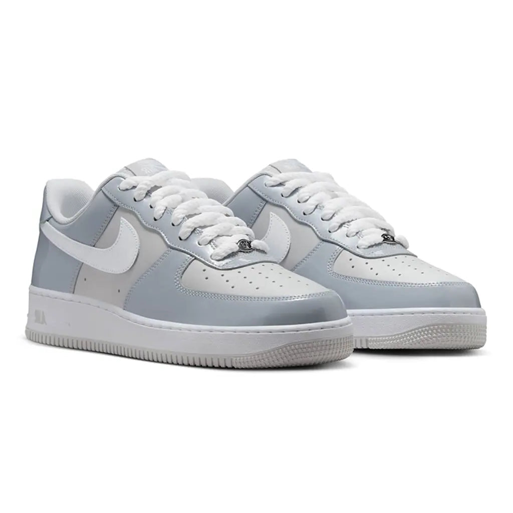 Nike Air Force 1 Low Wolf Grey Vast Grey pair front three-quarter view showing grey panels and white Swoosh