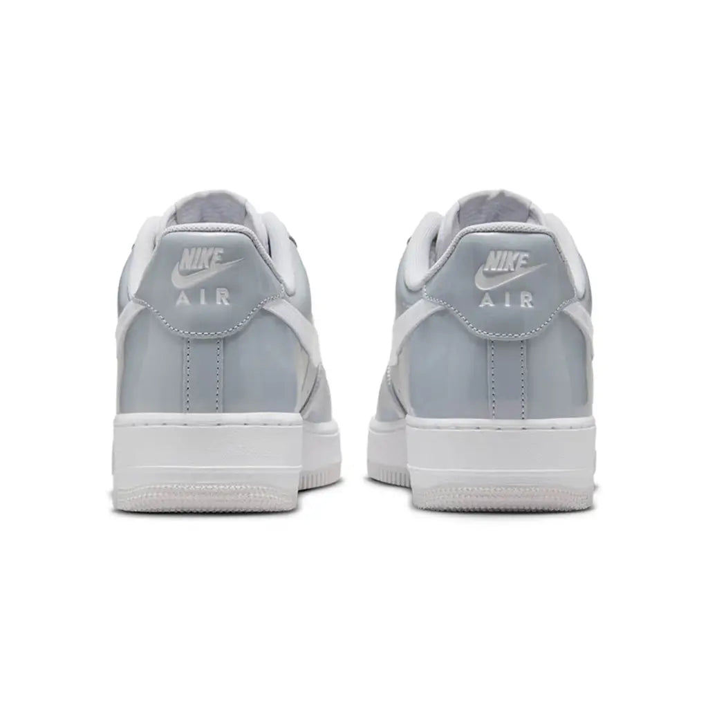 Nike Air Force 1 Low Wolf Grey Vast Grey pair rear view showing Nike Air heel branding on grey leather