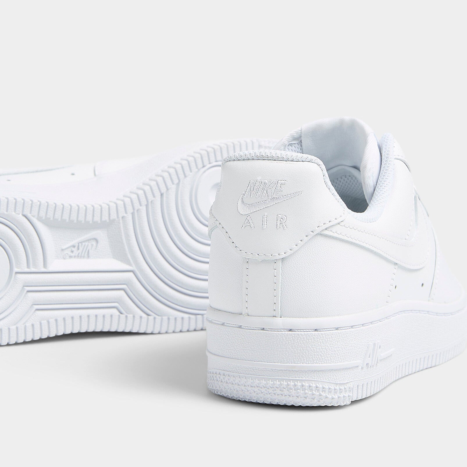 Nike Air Force 1 '07 Triple White close-up of heel tab with Nike Air logo and pivot-circle outsole