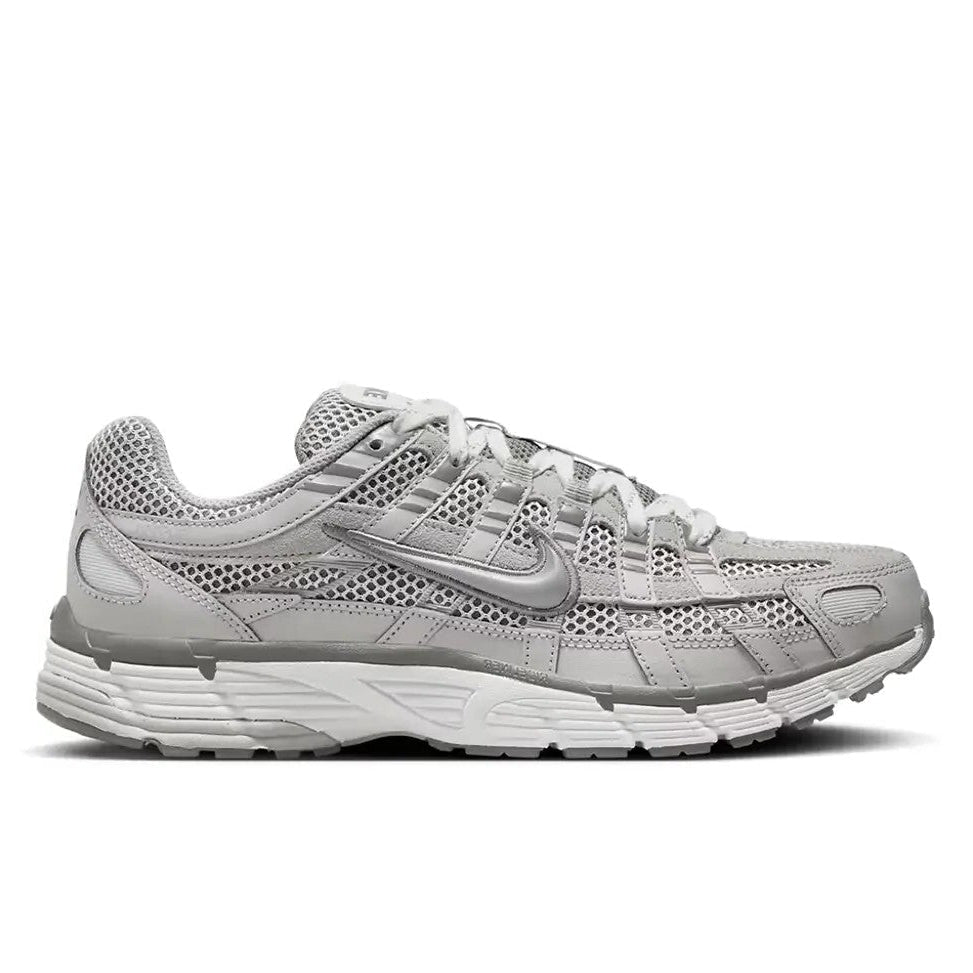 Nike P-6000 Light Iron Ore lateral side profile on white background showing light iron ore grey mesh and leather upper, silver moulded Swoosh, and white layered midsole