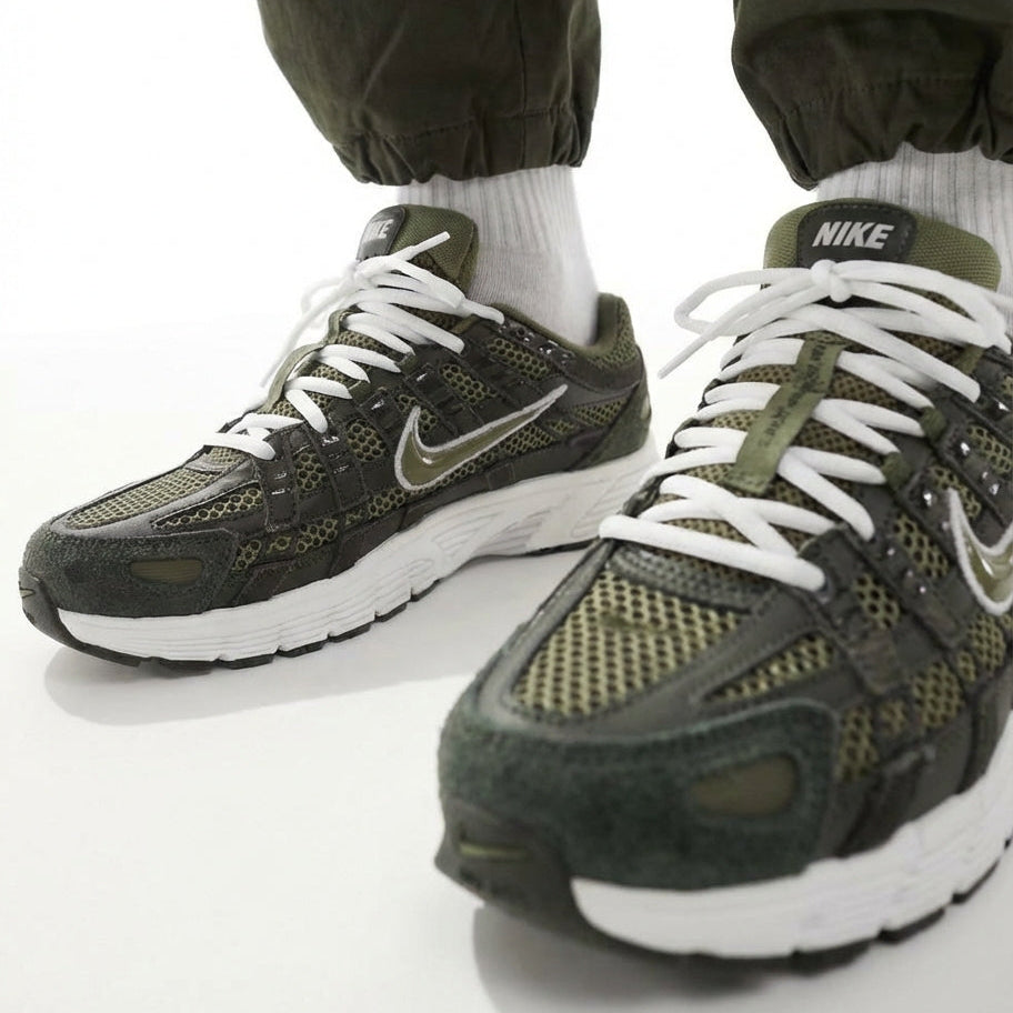 Nike P-6000 Sequoia Medium Olive on feet close-up front angle showing olive mesh toe box and suede mudguard