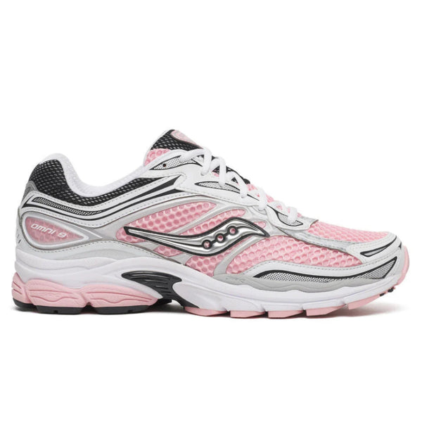 A side view of the Saucony ProGrid Omni 9 White Touch trainer, showing the pink mesh upper, layered white and silver panels, signature Saucony wave logo and sculpted sole.