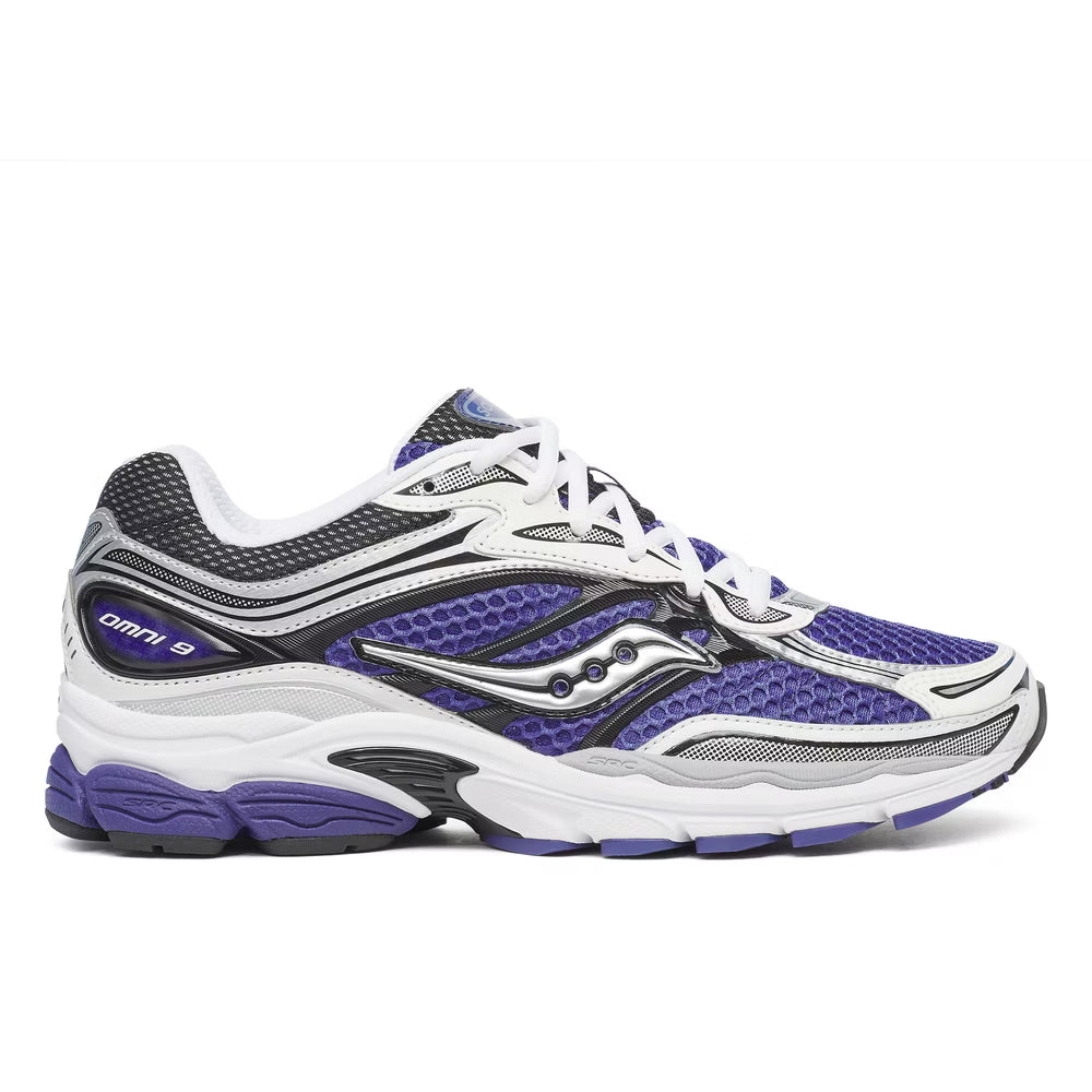 Side profile of the Saucony ProGrid Omni 9 (S70739-25), highlighting the raw running heritage design, classic Saucony branding, and visible ProGrid midsole.