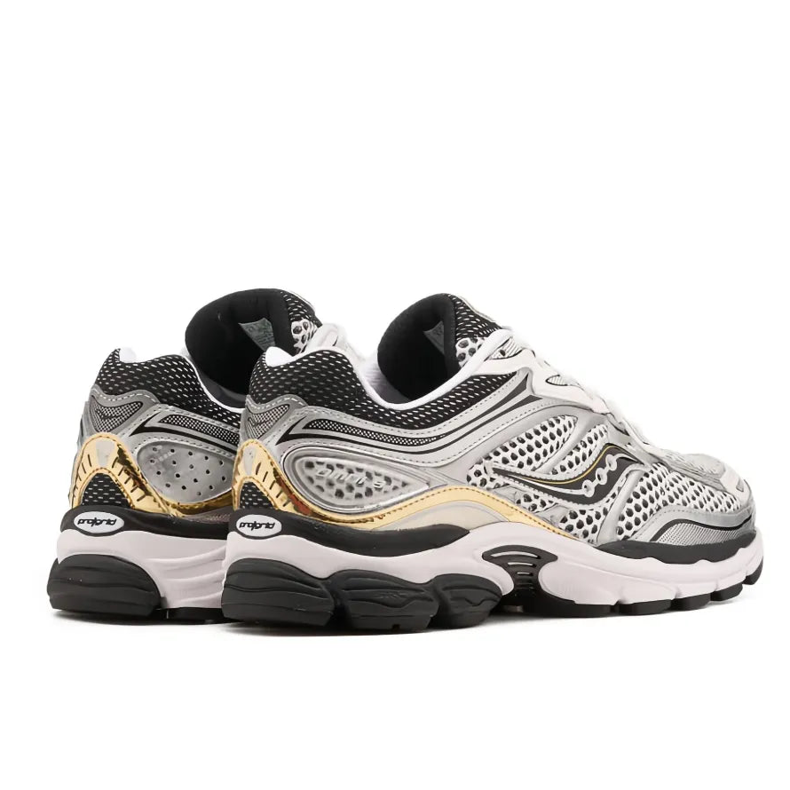 Back heel view of the Saucony ProGrid Omni 9 S70739-9 running shoe, displaying the commanding heel structure, metallic gold accents, and shock-absorbing base.