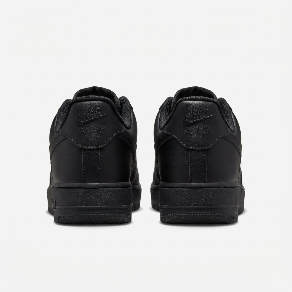 Nike Air Force 1 07 Triple Black rear heel view showing embossed Nike Air branding and padded collar detail