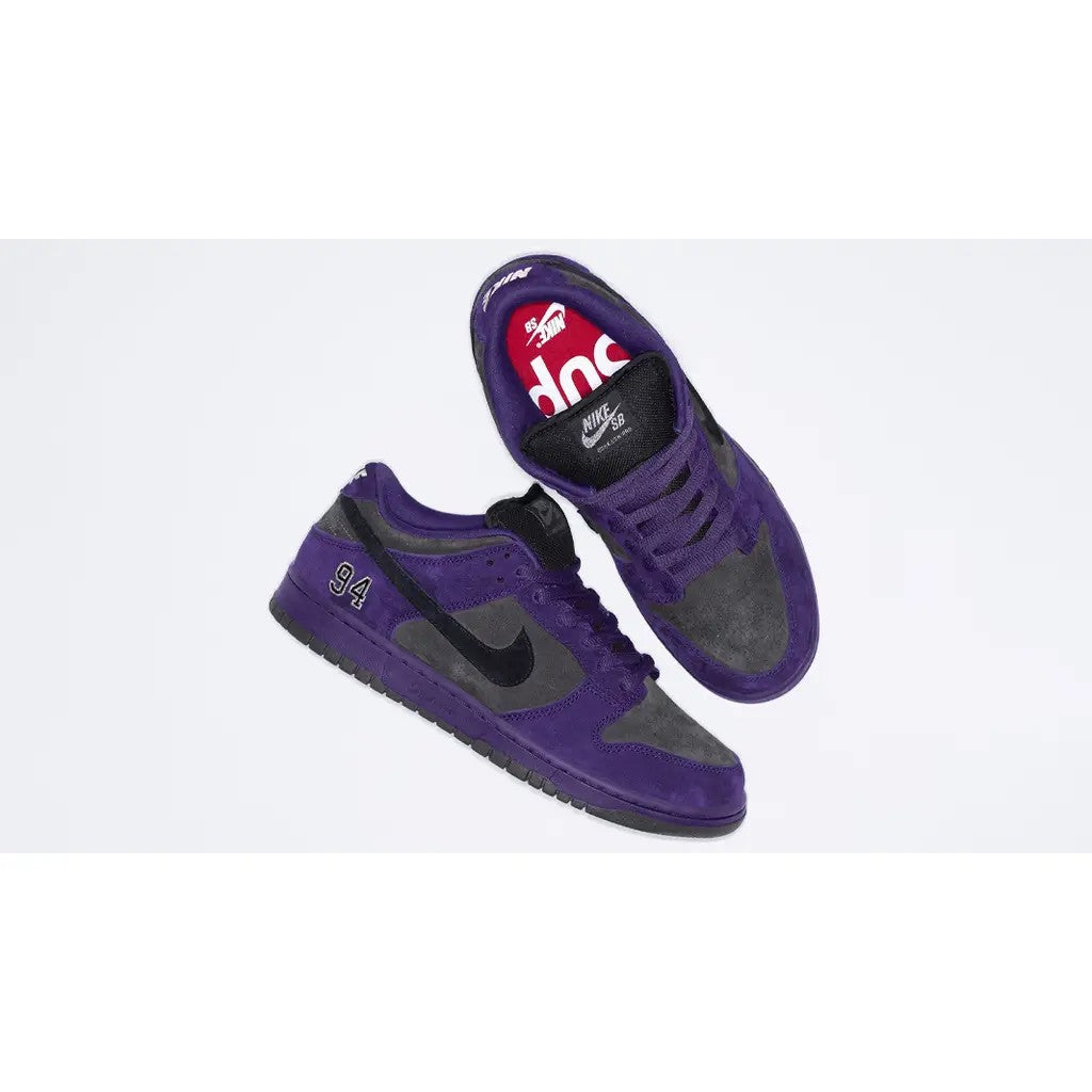 Supreme x Nike SB Dunk Low Ink Black pair stacked showing lateral side, red Supreme insole and Nike SB tongue label