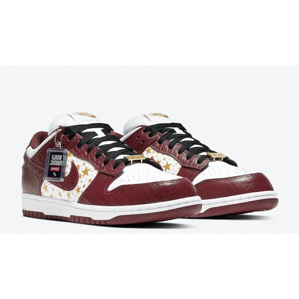 Supreme x Nike SB Dunk Low Stars Black lateral side profile showing black croc leather, gold star panels and white midsole