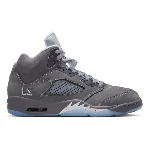 Side profile of the Air Jordan 5 Wolf Grey, highlighting the white contrast stitching, embroidered 23, speckled shark teeth, and icy translucent outsole.